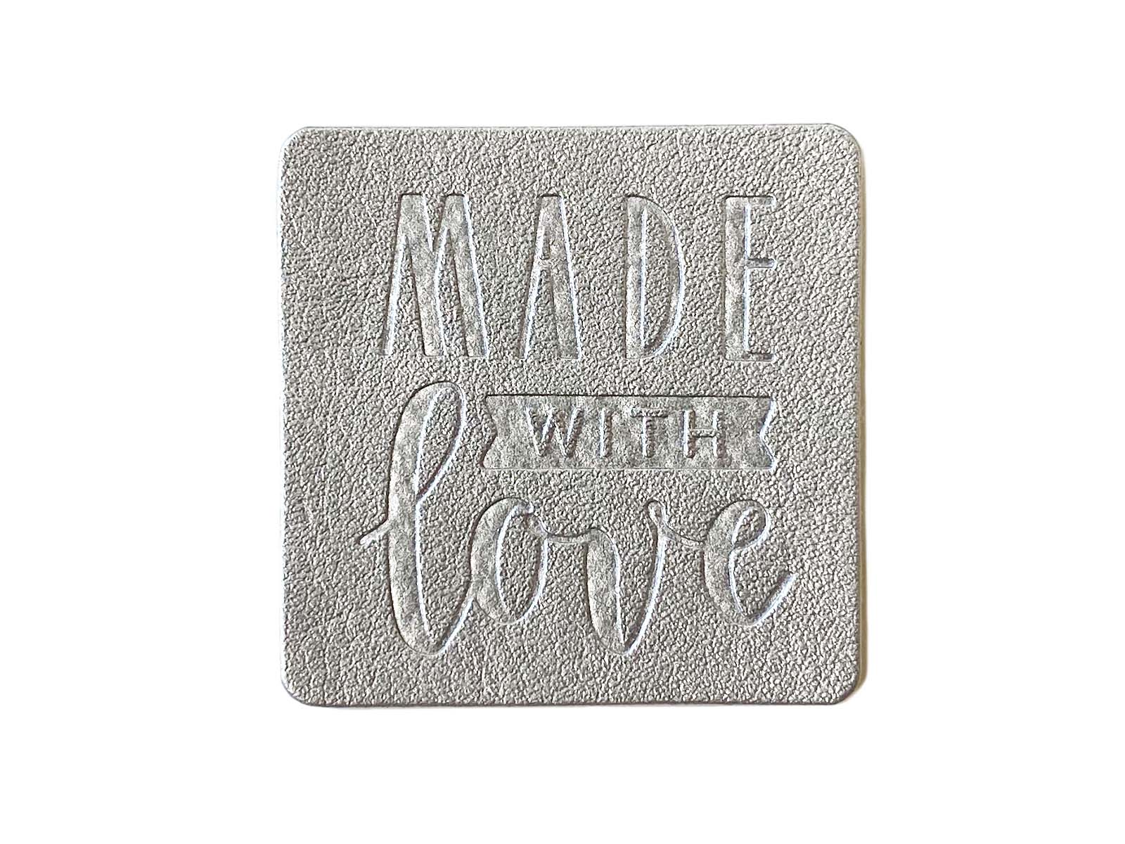 Label aus Kunstleder - "Made with love" in silber Label aus Kunstleder - "Made with love" in silber