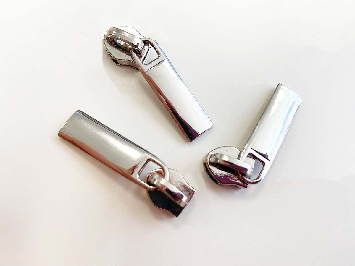 Zipper für Reißverschlüsse - silber Zipper für Reißverschlüsse - silber